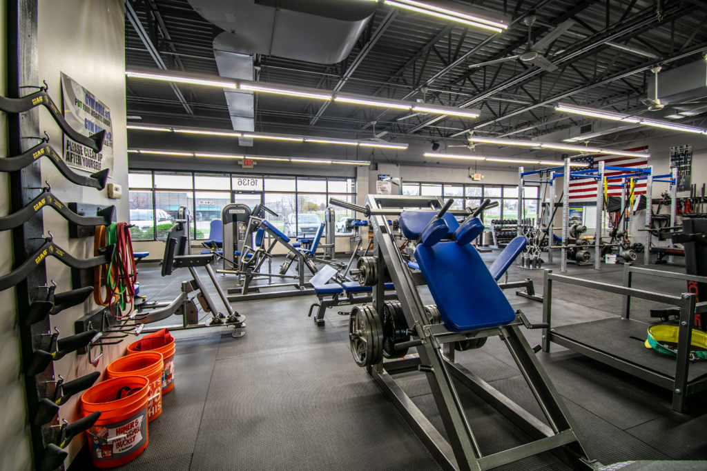 Back corner view of gym showing off equipment