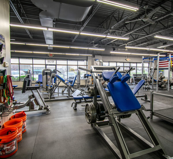 Back corner view of gym showing off equipment